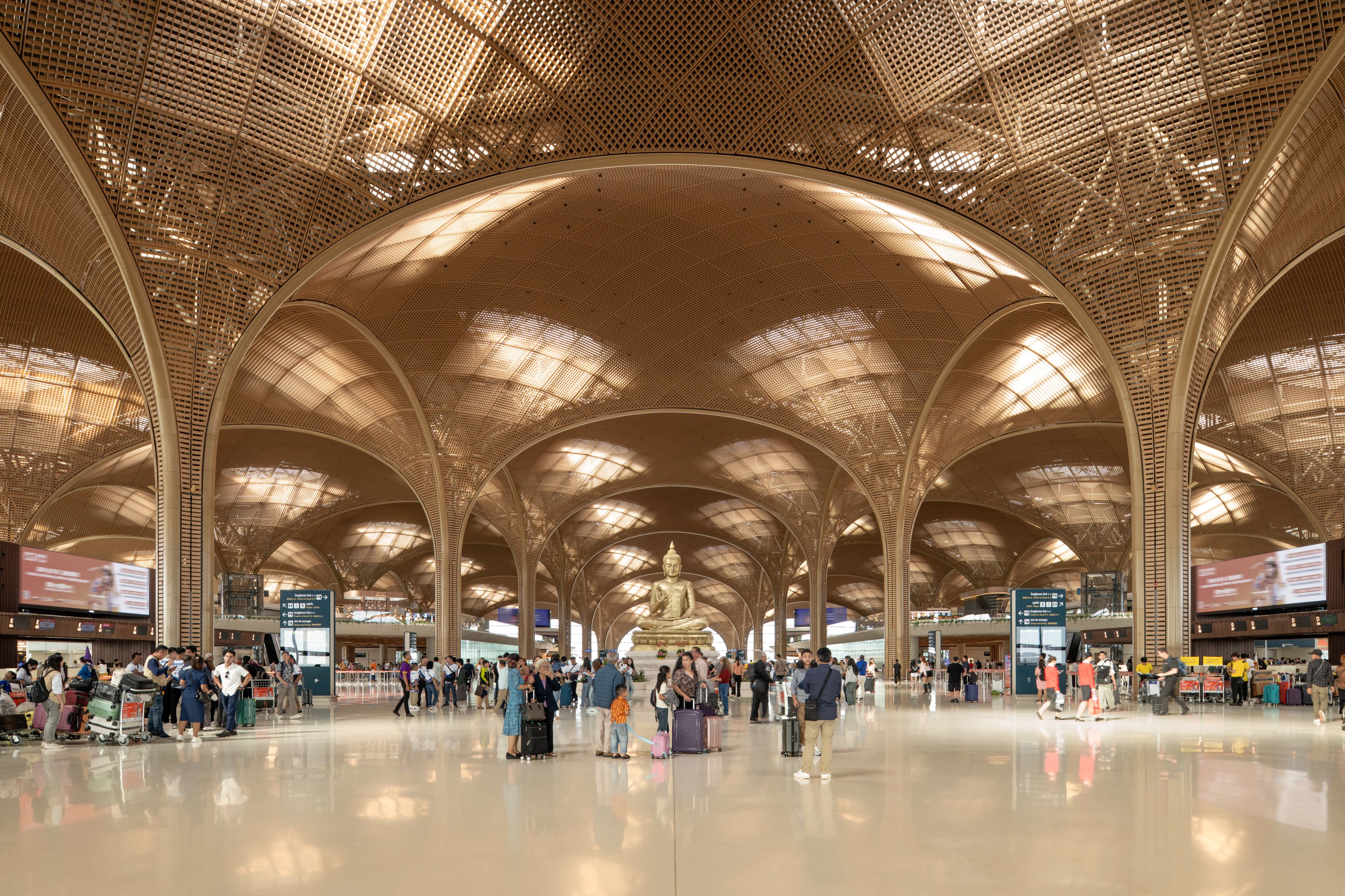 Techo International Airport, Phnom Penh - Suspended under the building's lightweight steel grid shell structure, a latticed soffit filters daylight into the vast terminal space throughout the day.