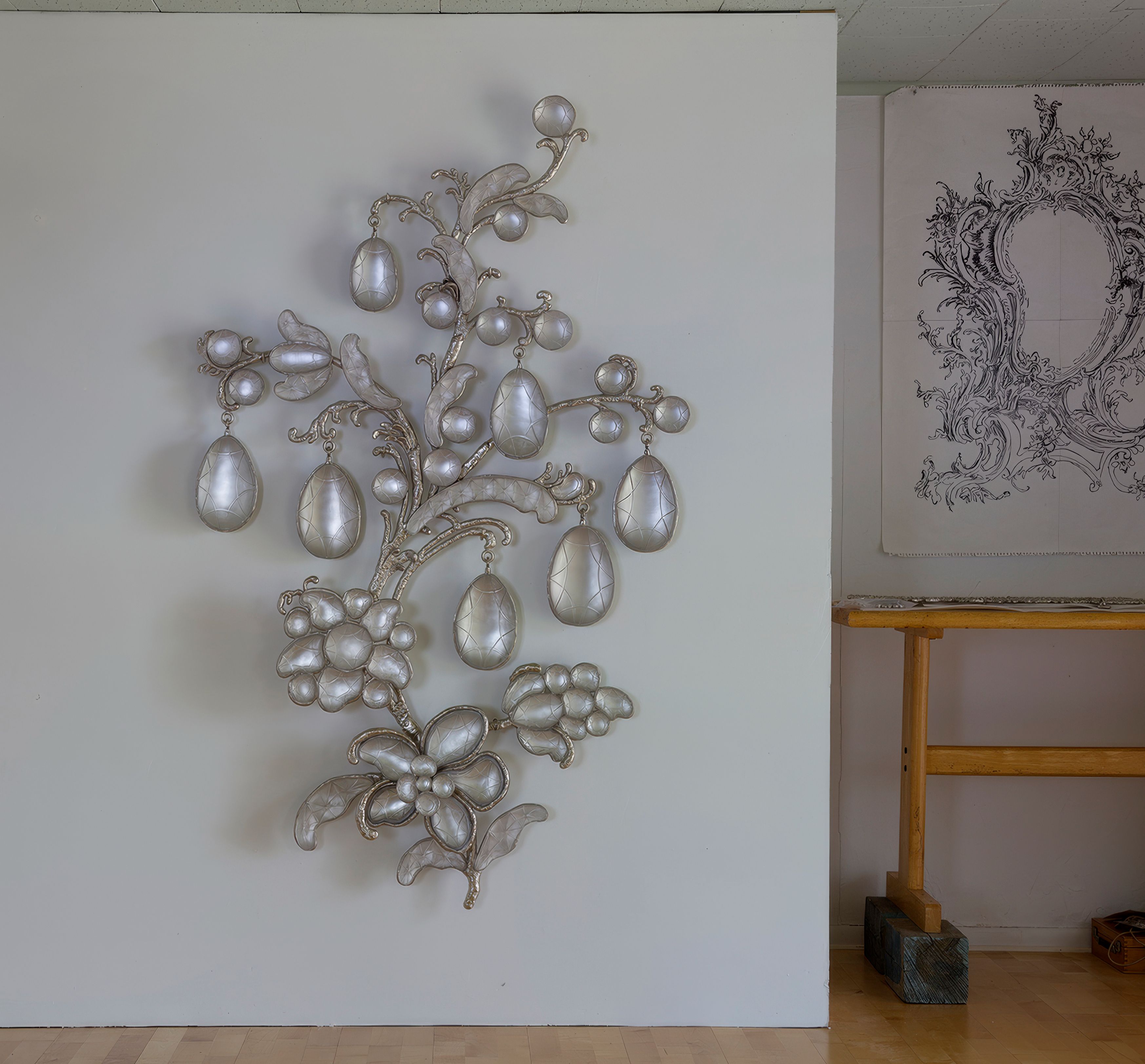 Stardust & Moonlight, 2015, nickel-plated bronze, foiled cast crystal, mirrored blown glass, 70 x 44 x 6 inches. Inspired by the 17th-century pattern for a hair ornament.