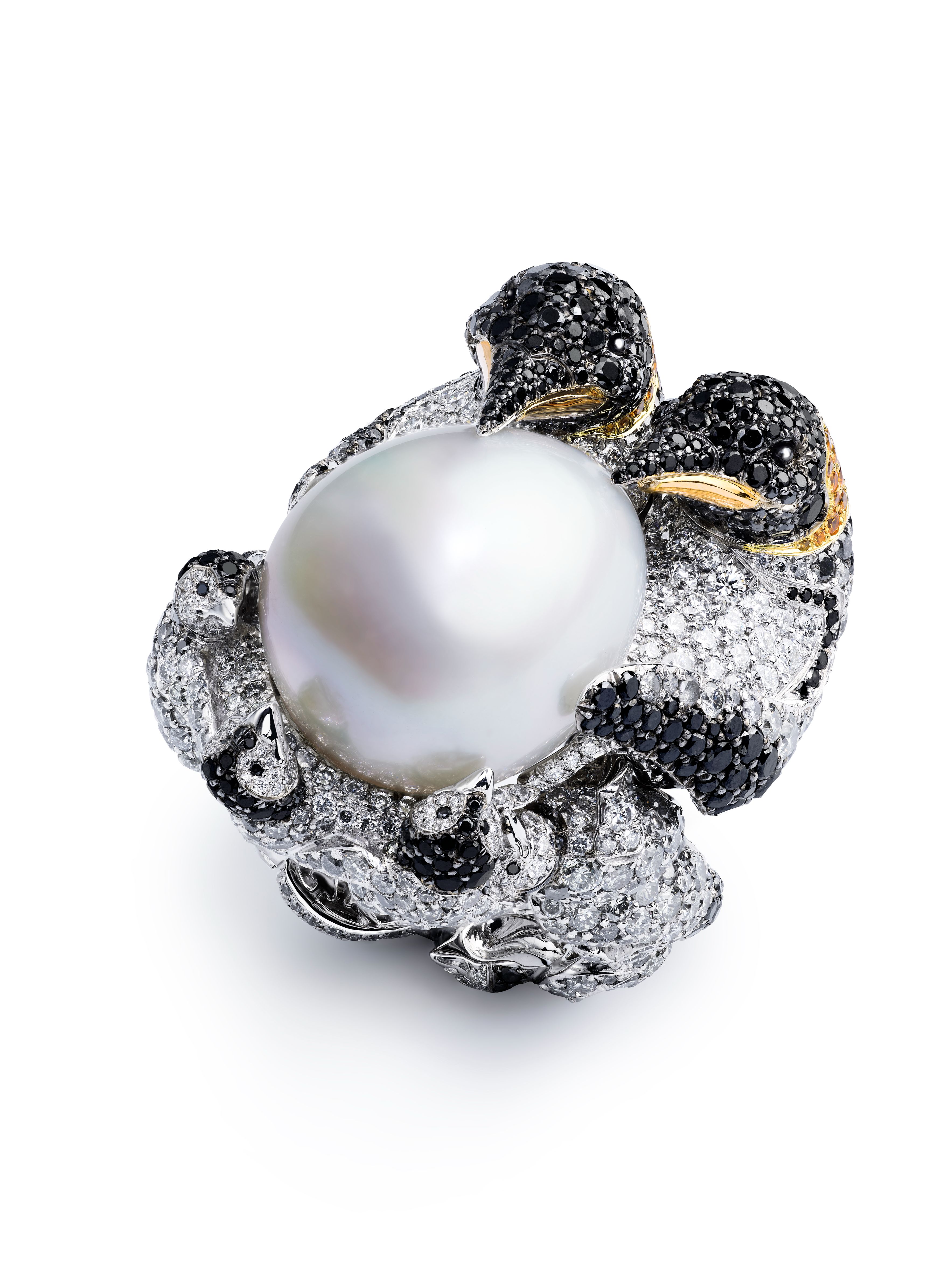 Chopard's Red Carpet Collection 2025, 'Caroline's Universe' - Penguin ring in ethical 18-carat white and yellow gold featuring a Southern Seas pearl (30.91 cts), set with brilliant-cut black (10.84 cts) and white (1.06 ct) diamonds, as well as brilliant-cut Spessartite garnets (0.34 ct) and onyx cabochons.