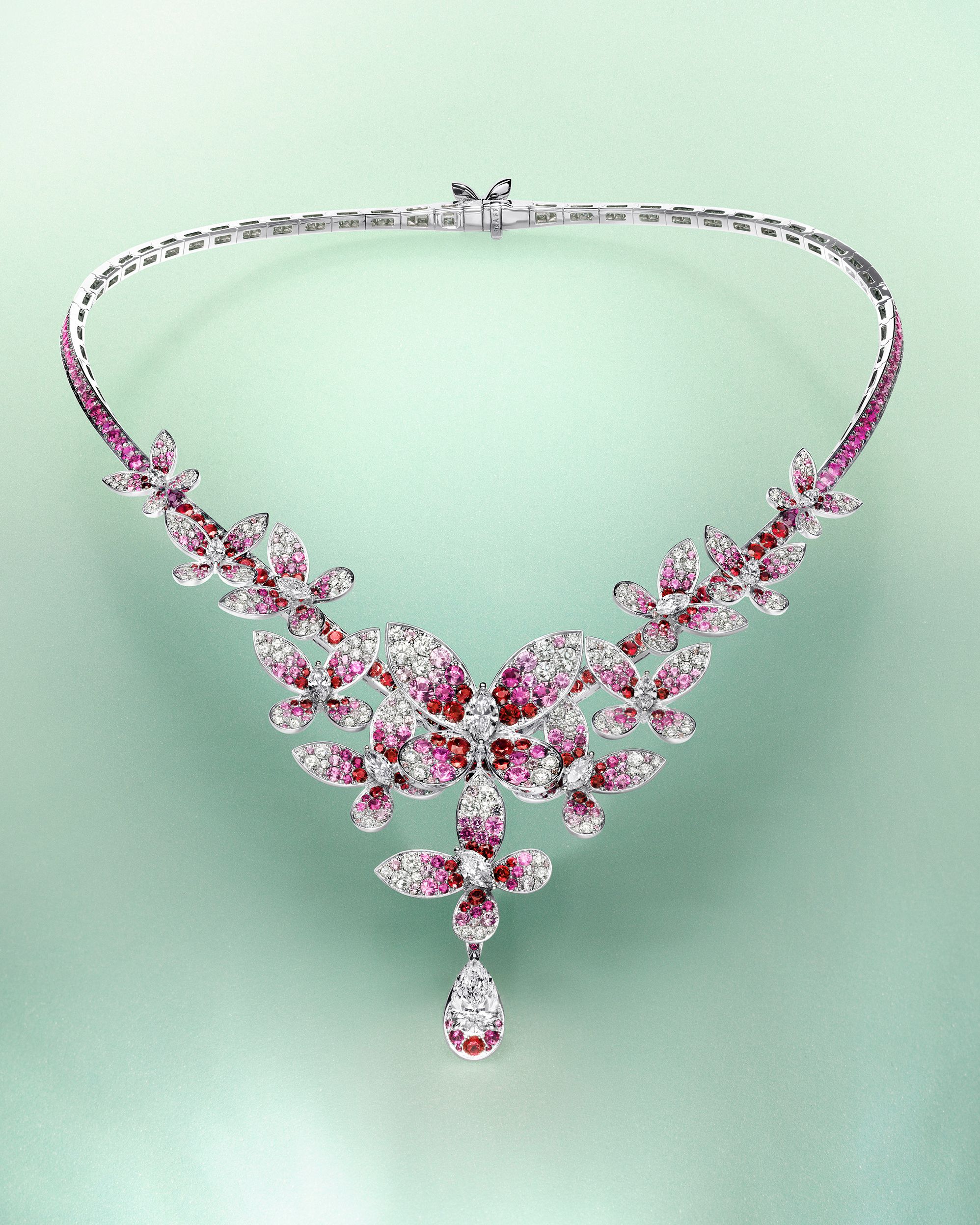 Graff's butterfly wings transition from the depth of red rubies through vibrant pink sapphires, forming a soft gradient into luminous white diamonds.