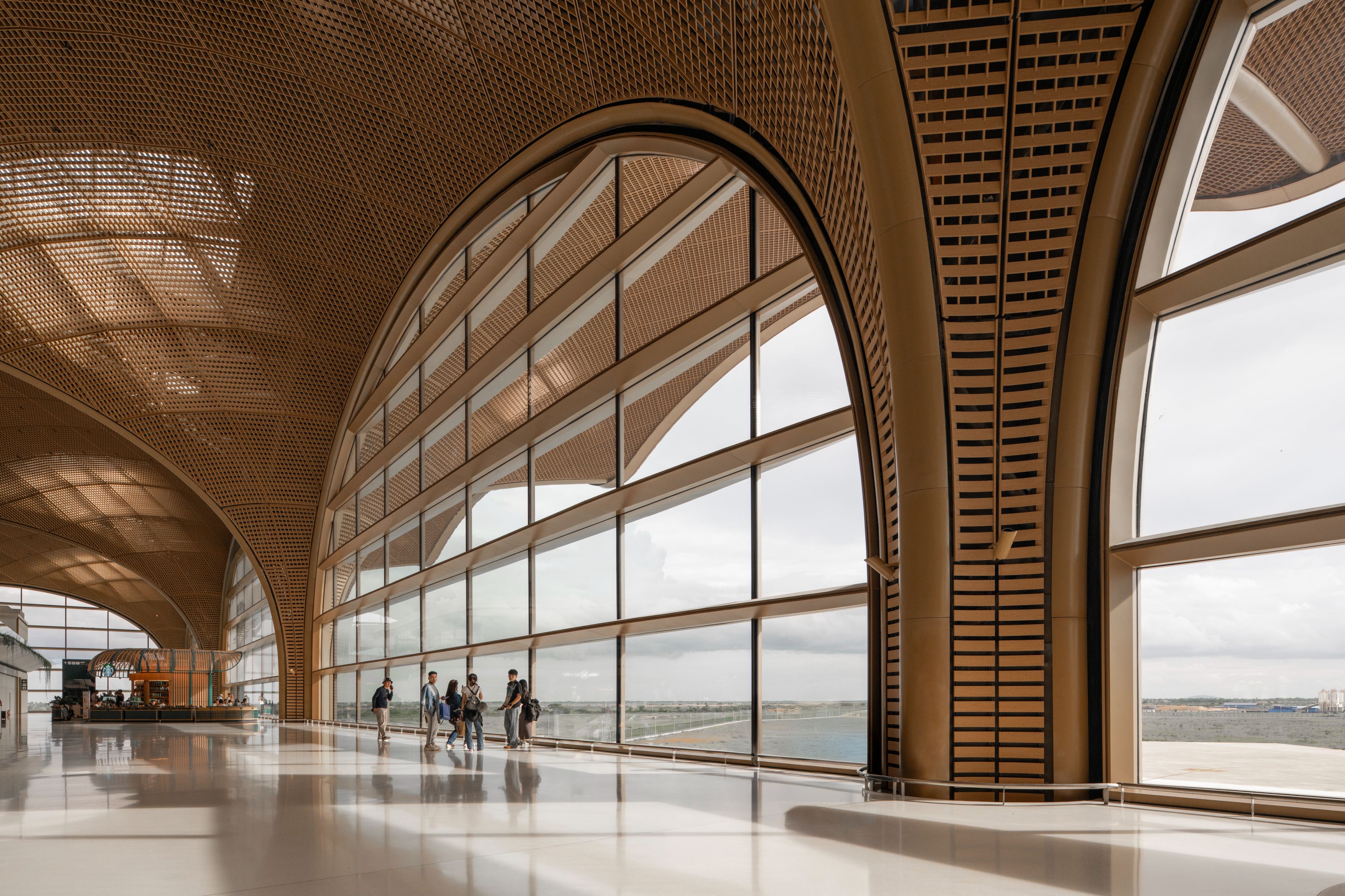 Techo International Airport, Phnom Penh - The terminal's overhanging roof is designed to provide shading for the interior spaces, reducing the need for mechanical ventilation.