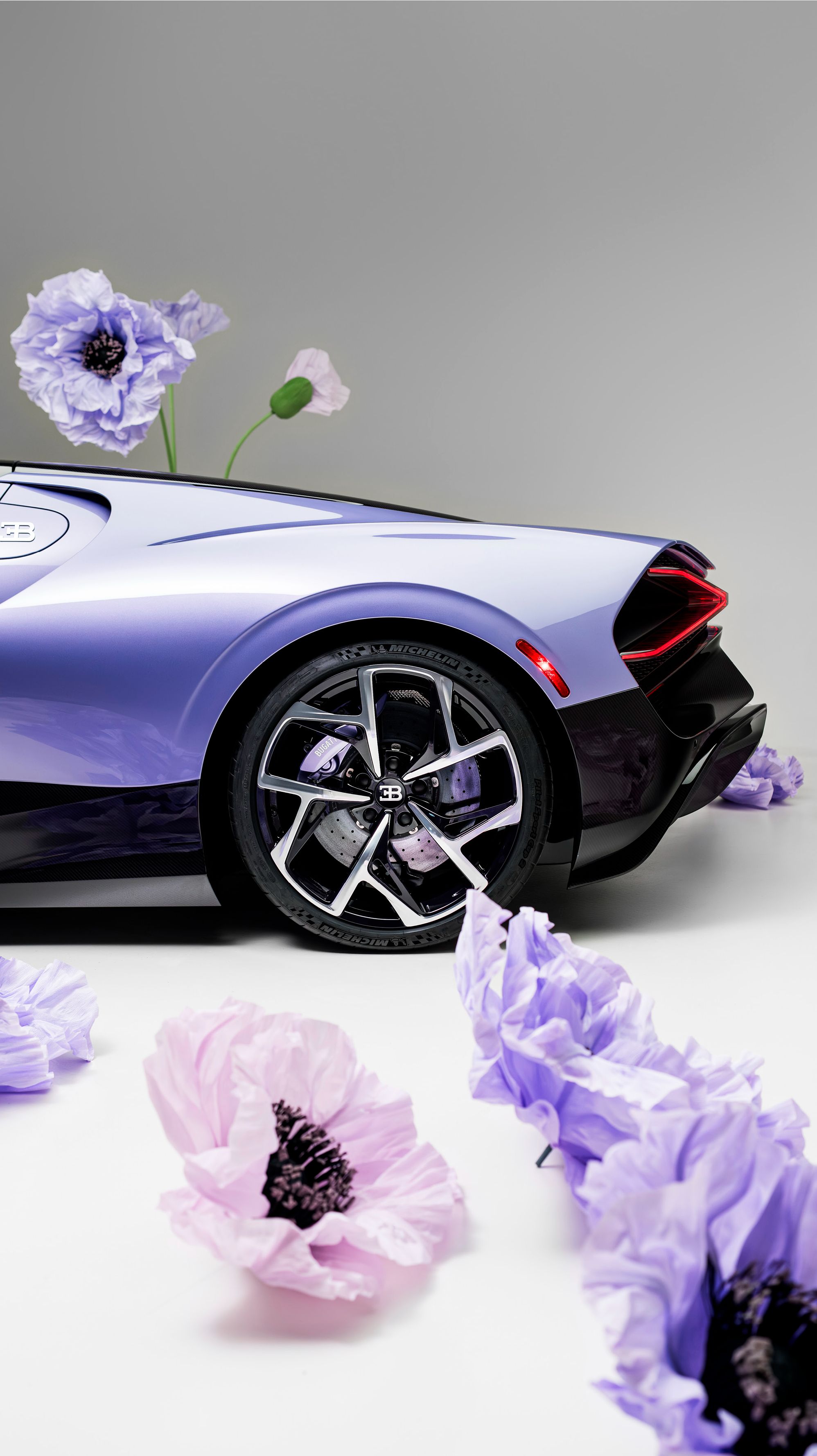The exterior of the Bugatti W16 Mistral 'Caroline' reveals itself subtly, in nuance and movement. Its defining color, bespoke 'Lavender' paintwork.