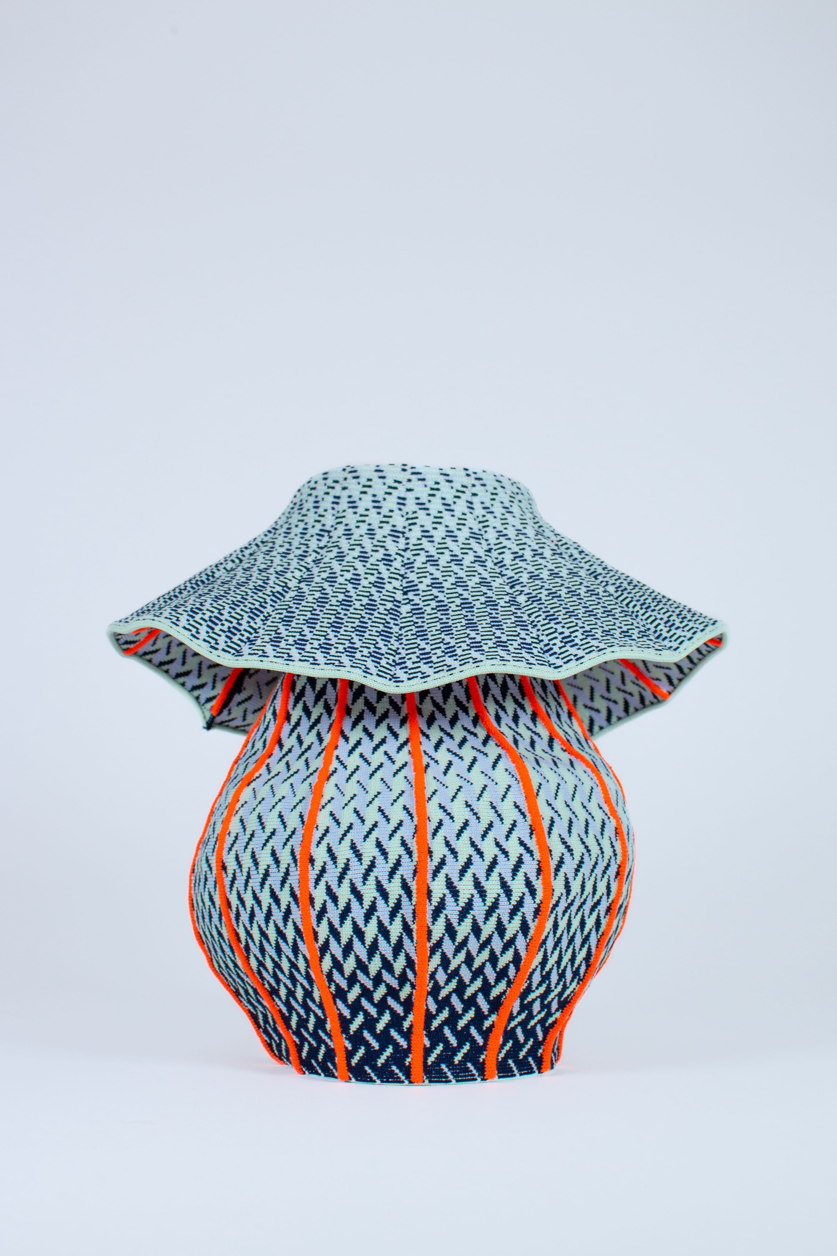 Soft Objects — Different yarns and color combinations transform the same knitting program into new forms, textures and visual rhythms.