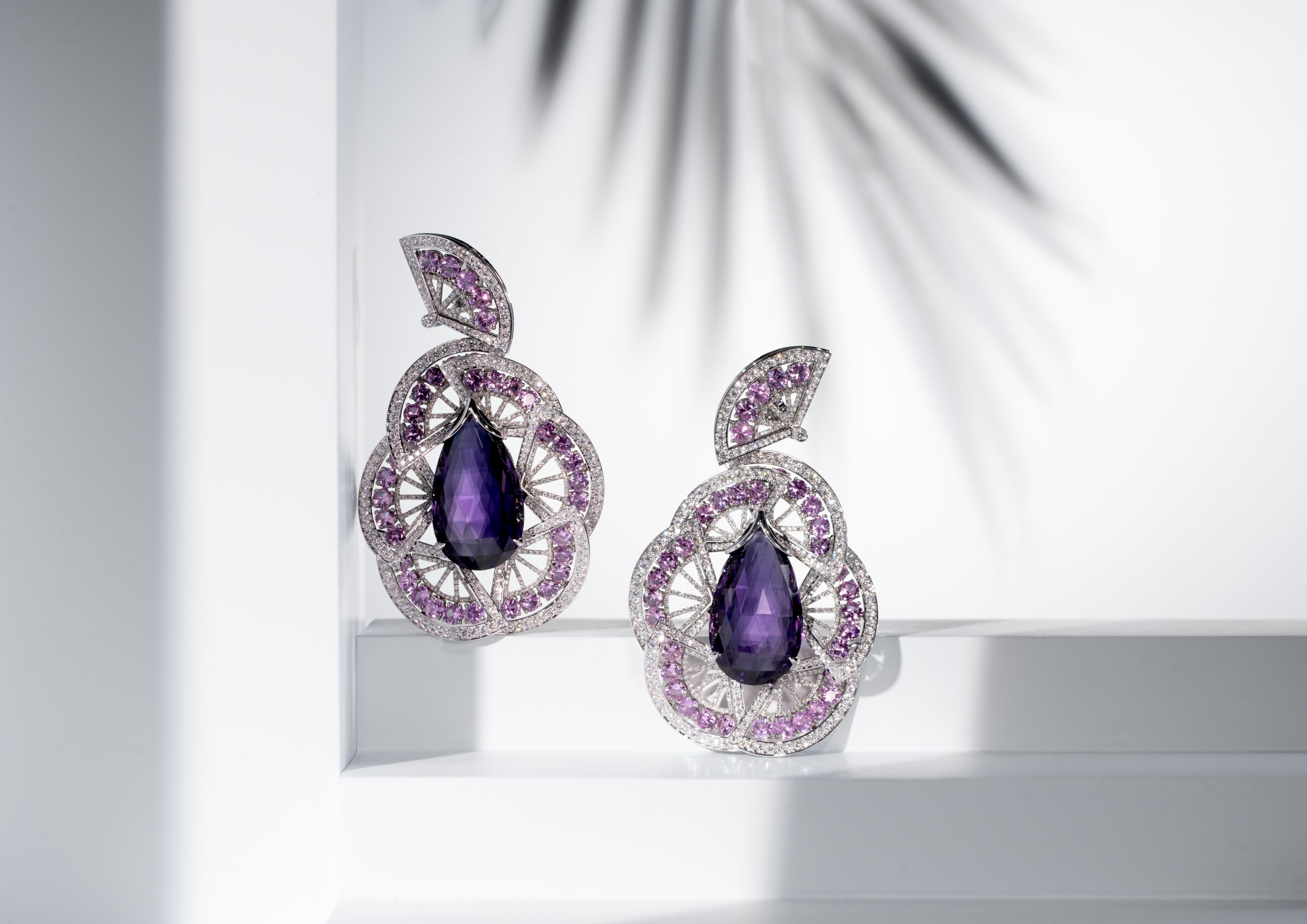 Chopard's Red Carpet Collection 2025, 'Caroline's Universe' - Earrings in titanium set with two amethyst briolettes (43.67 cts), brilliant-cut pink sapphires (14.48 cts) and diamonds (5.64 cts).