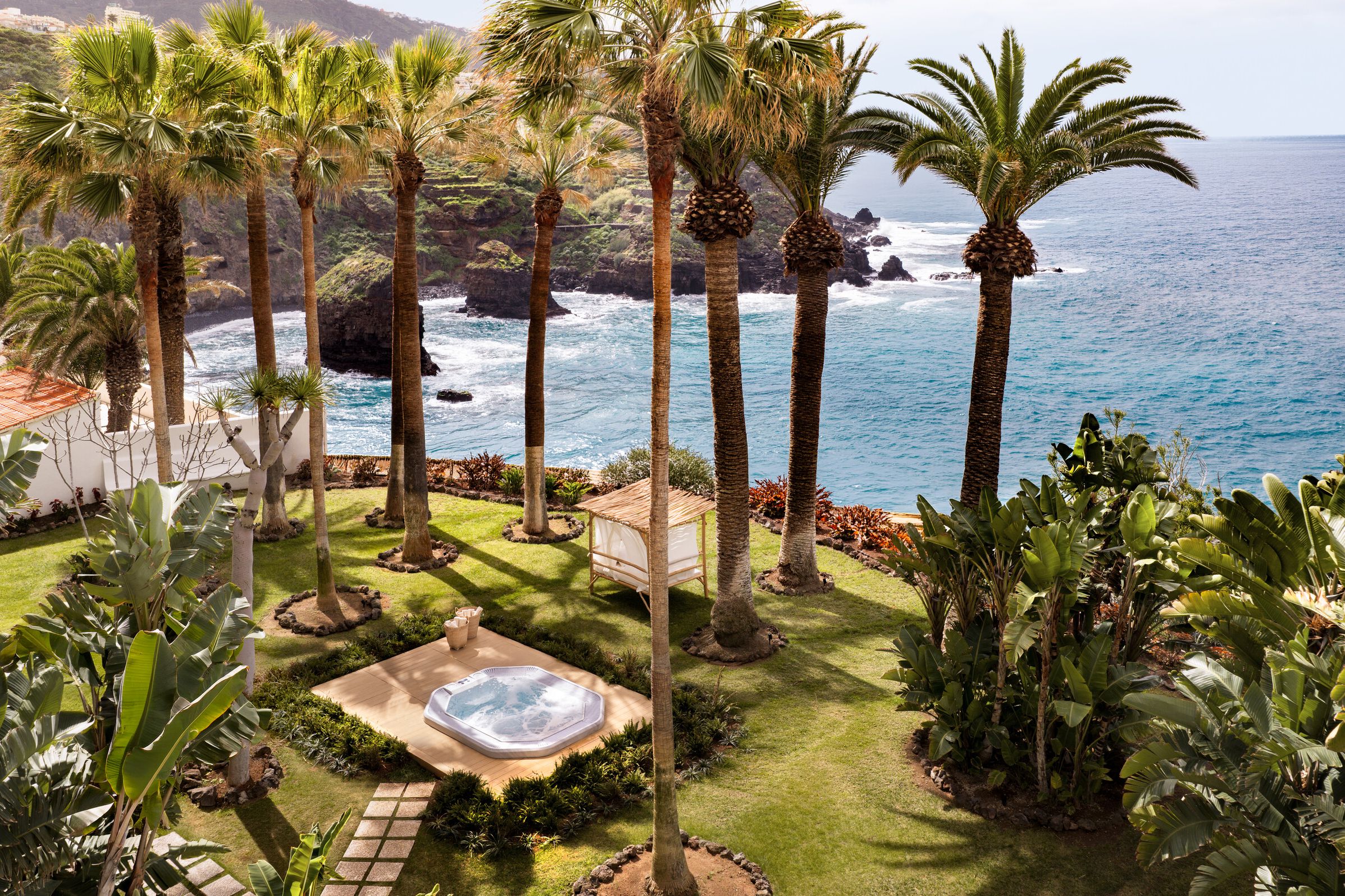 The vertical silhouette of Precise Resort Tenerife rises above the northern Tenerife coastline, a landmark originally built in the late 1970s