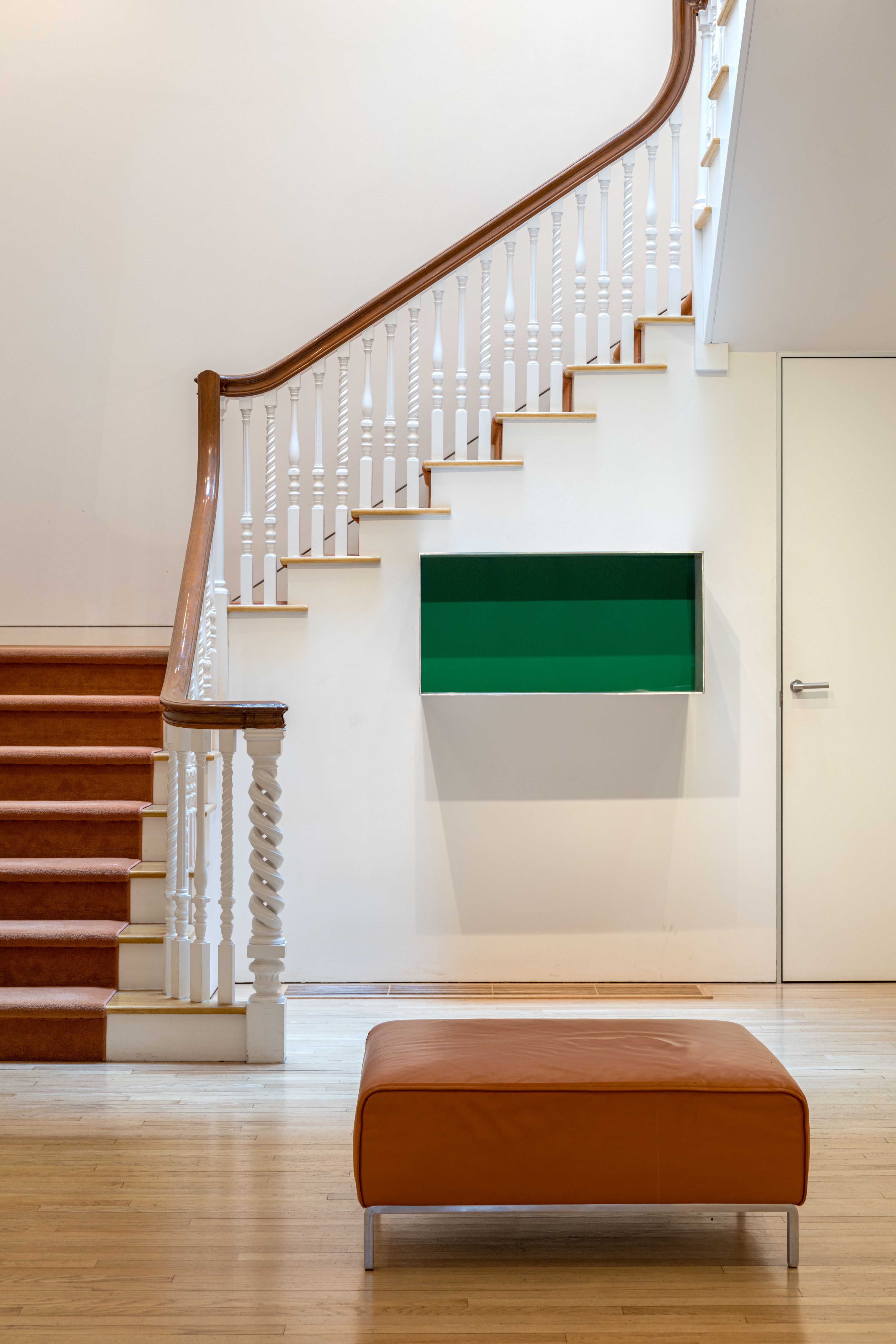 Donald Judd's iconic copper stack anchors the living room of Henry S. McNeil Jr.'s Philadelphia residence, illustrating how Minimalist art can transform a domestic interior.