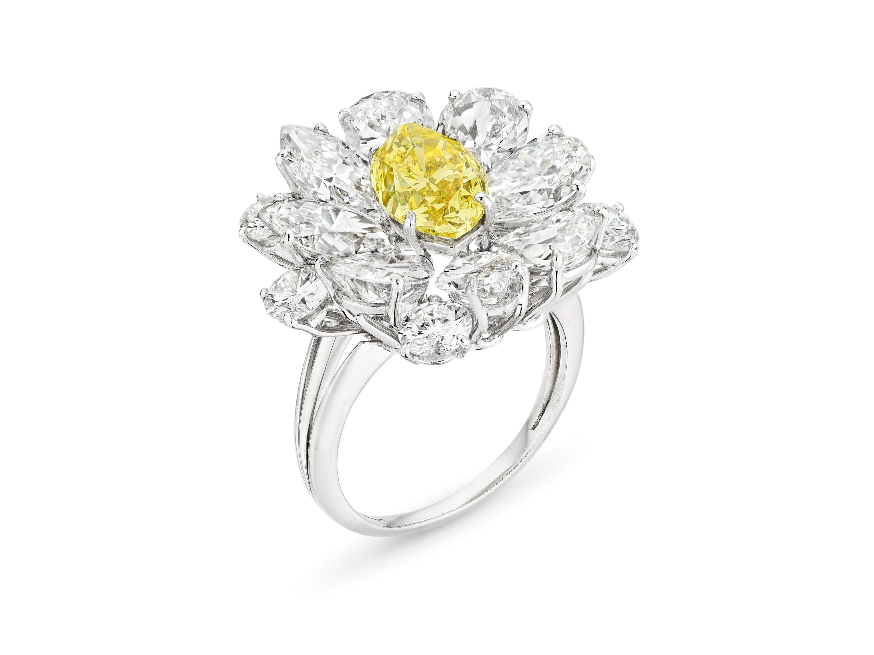Property formerly from the Collection of Elizabeth Taylor, Bulgari colored diamond and diamond ring. Fancy vivid yellow marquise brilliant-cut diamond of 2.62 carats, Price Realized: $215,900