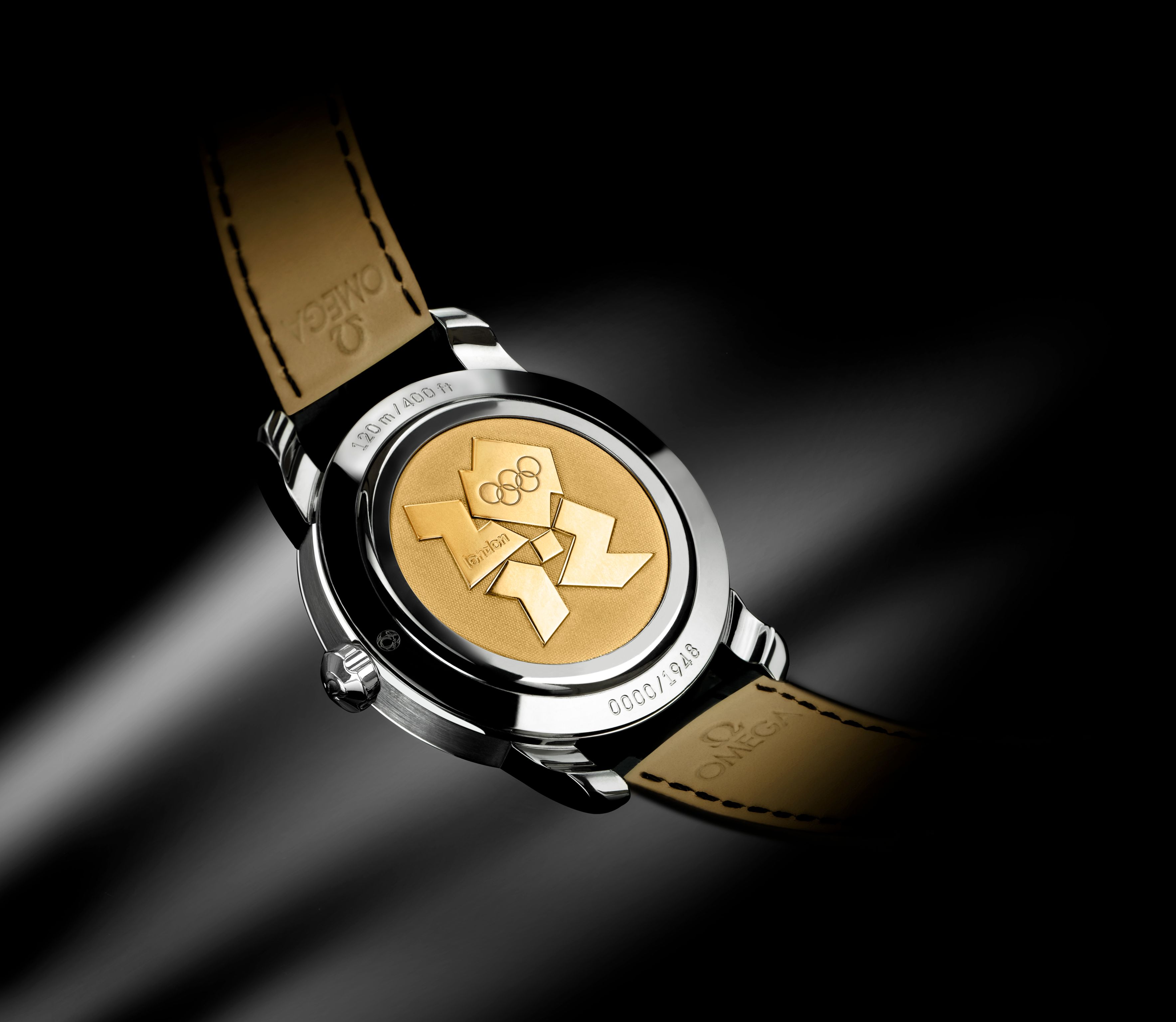 The Seamaster 1948 Co-Axial Limited Edition, London, England, Olympics 2012 - The silver case gives way to a yellow gold back emblazoned with the London commemoration. The contrast burns as brightly as the Olympic torch.