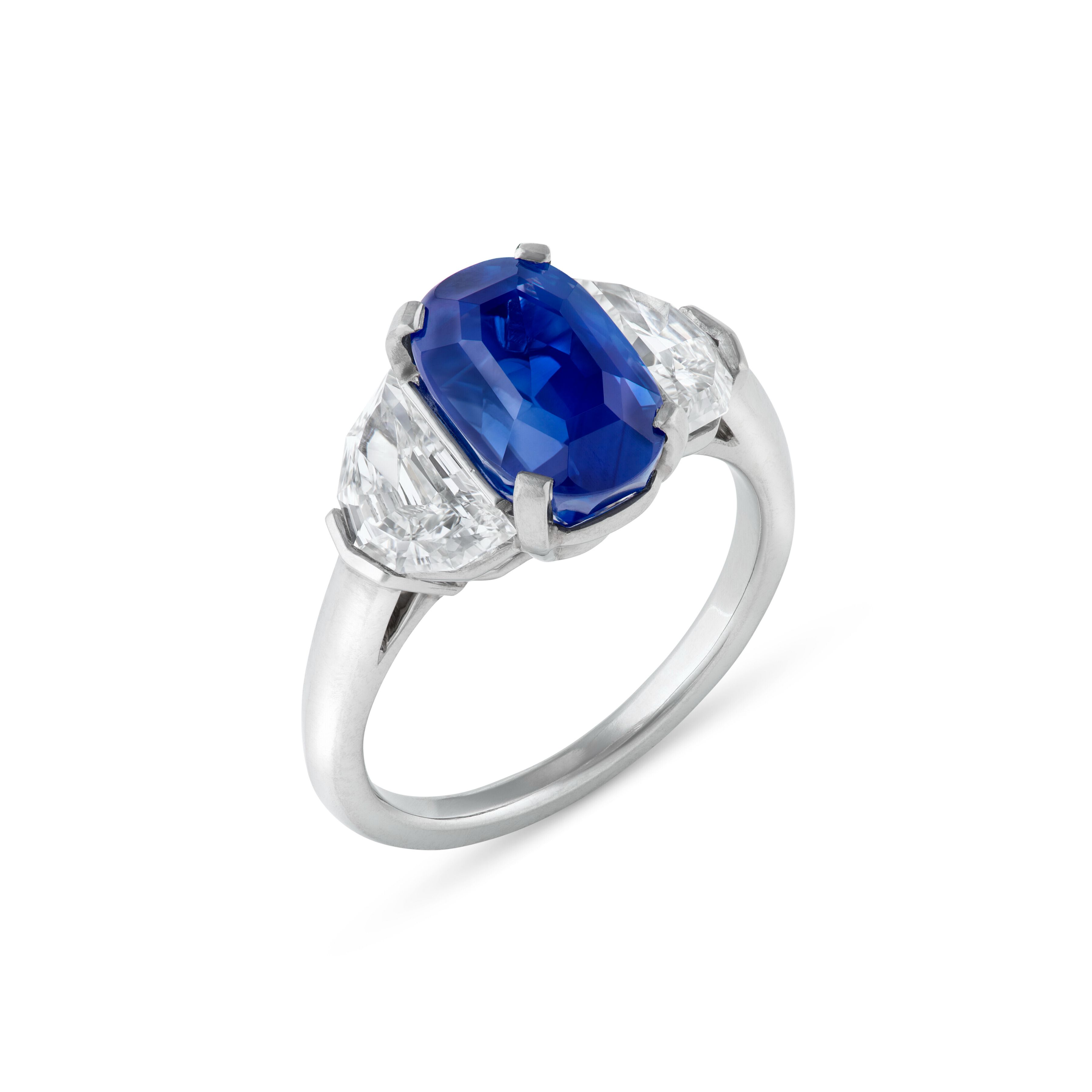 Sapphire and Diamond Ring - Oval step-cut sapphire of 4.74 carats.
