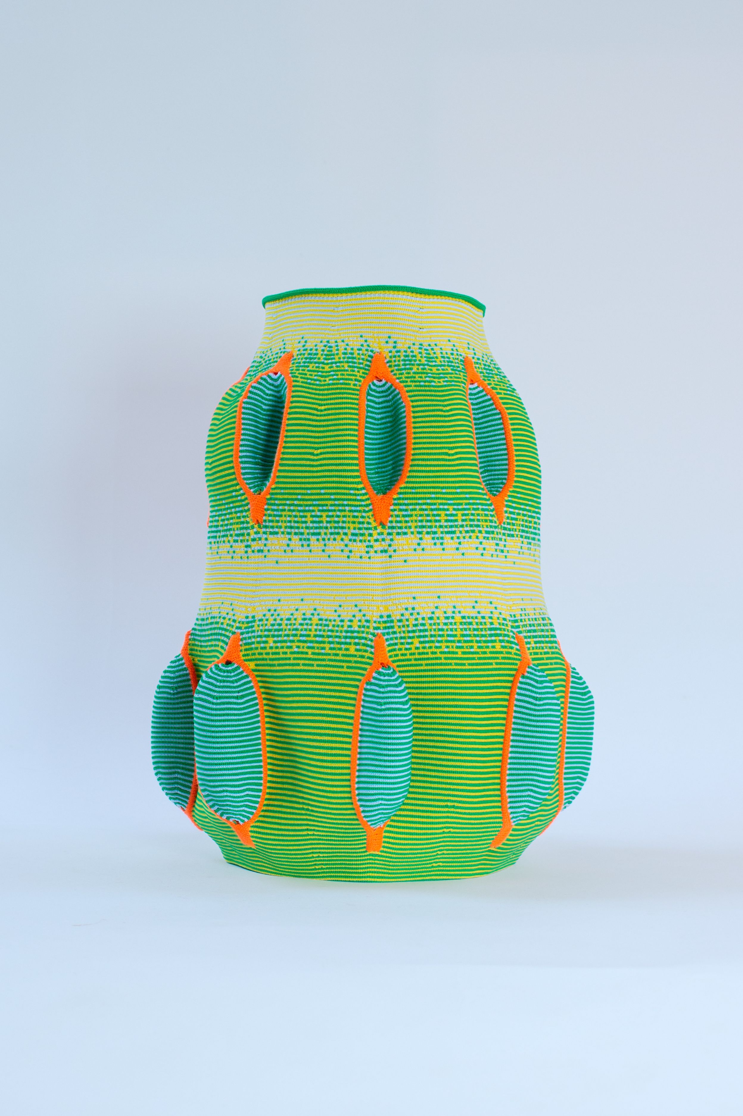 Knitted Form — The rhythm of the knitting machine becomes part of the creative process, transforming thread into volume through continuous movement.