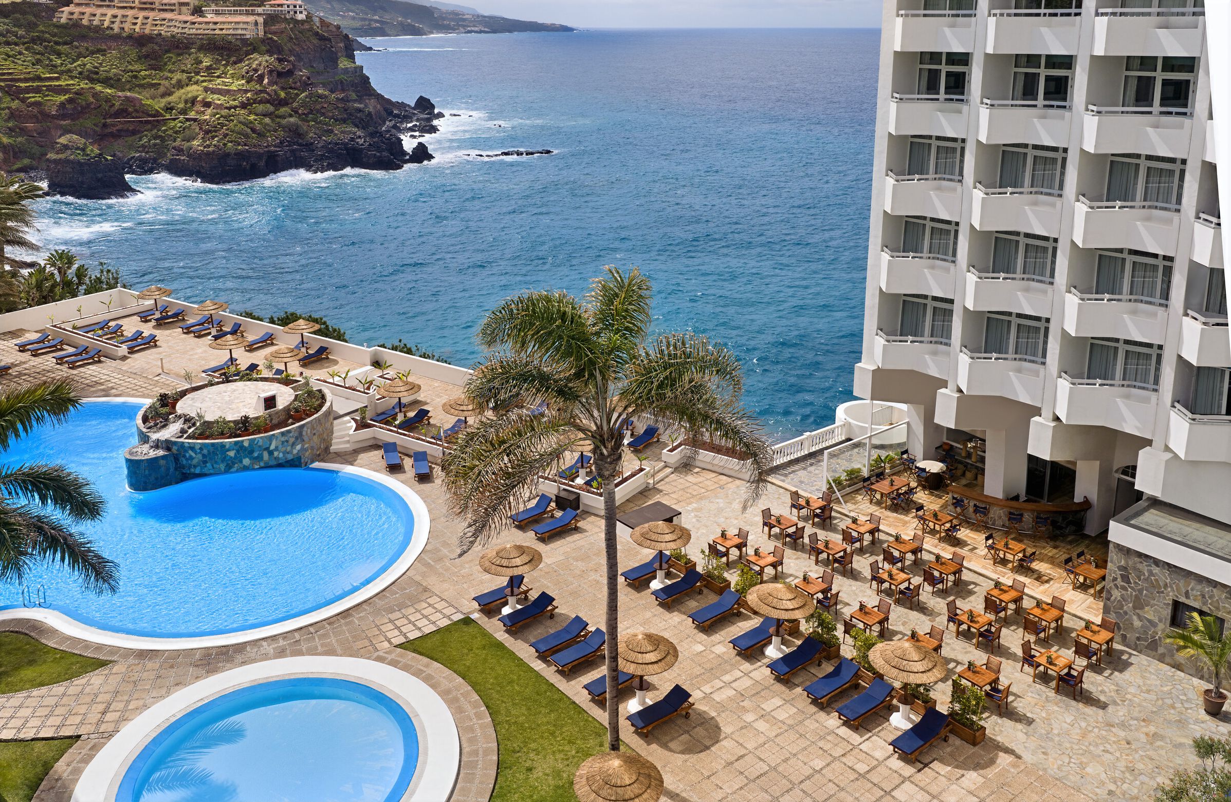 Heated pools overlook the Atlantic Ocean at Precise Resort Tenerife, designed for slow and intentional stays.