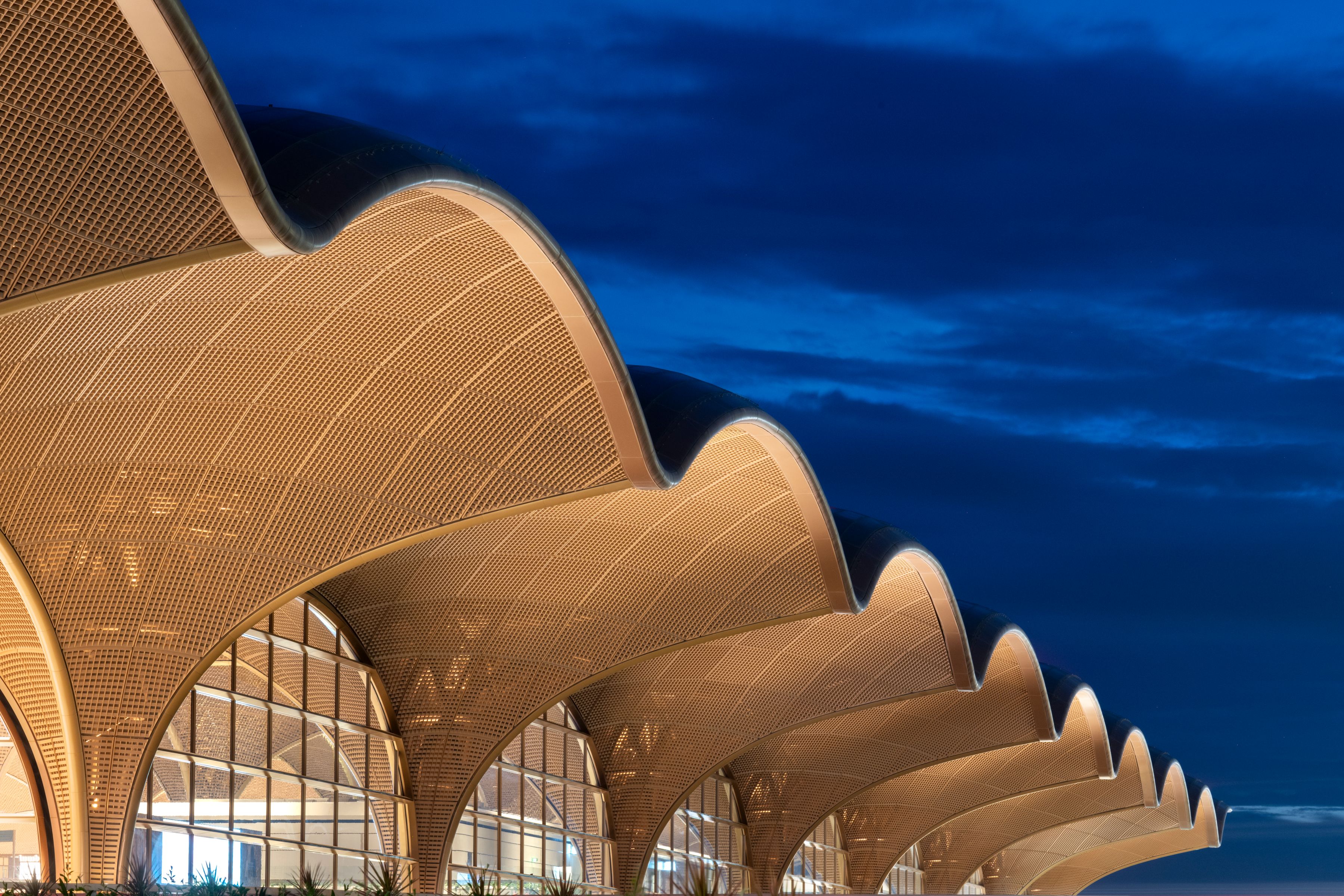 Techo International Airport, Phnom Penh - The roof has an undulating form that crescendos at the centre of the building, echoing Cambodia's spectacular palaces and temples.
