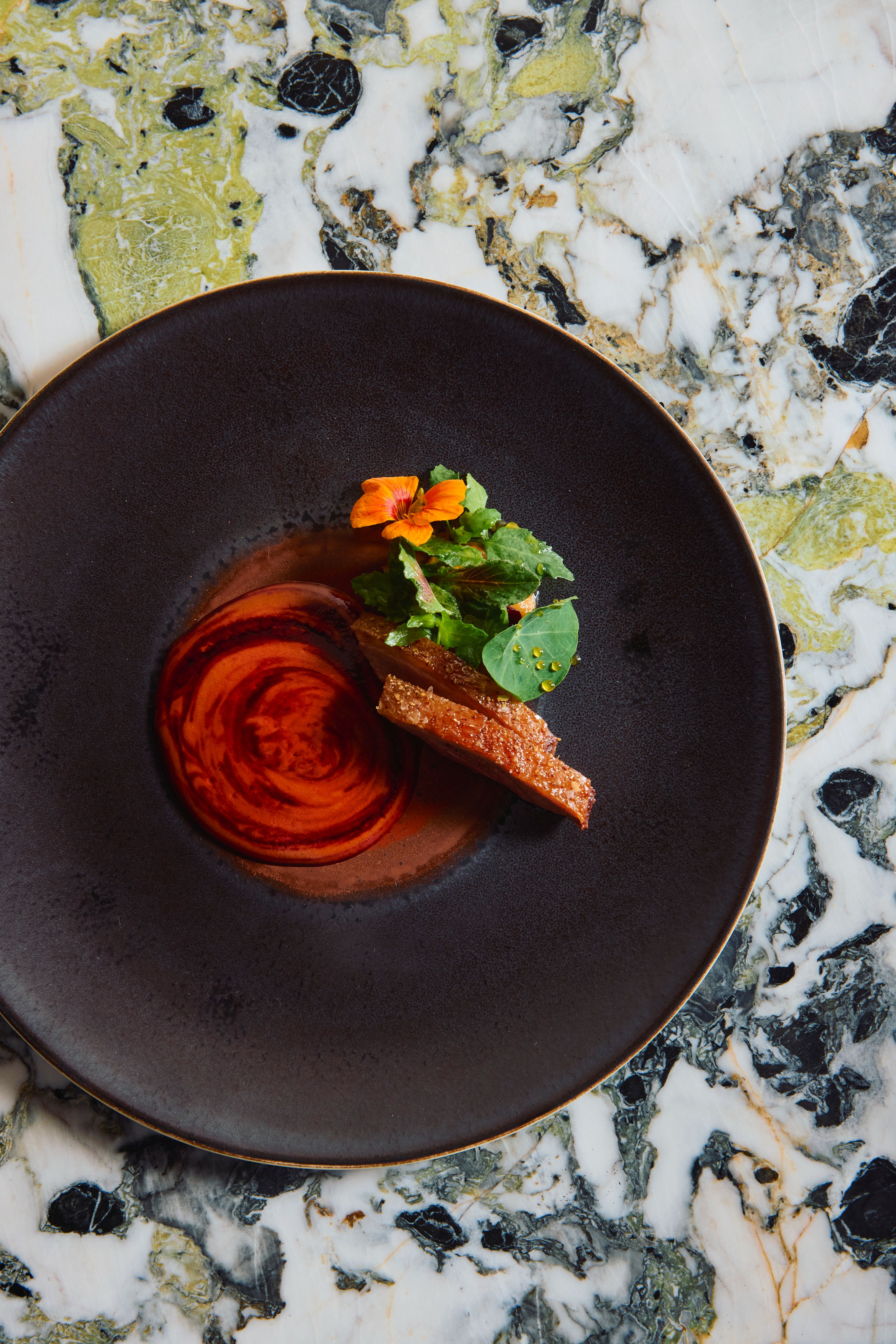 Quintonil, Mexico City, Mexico Aged duck with coconut manchamanteles mole, beet reduction, and apple honey