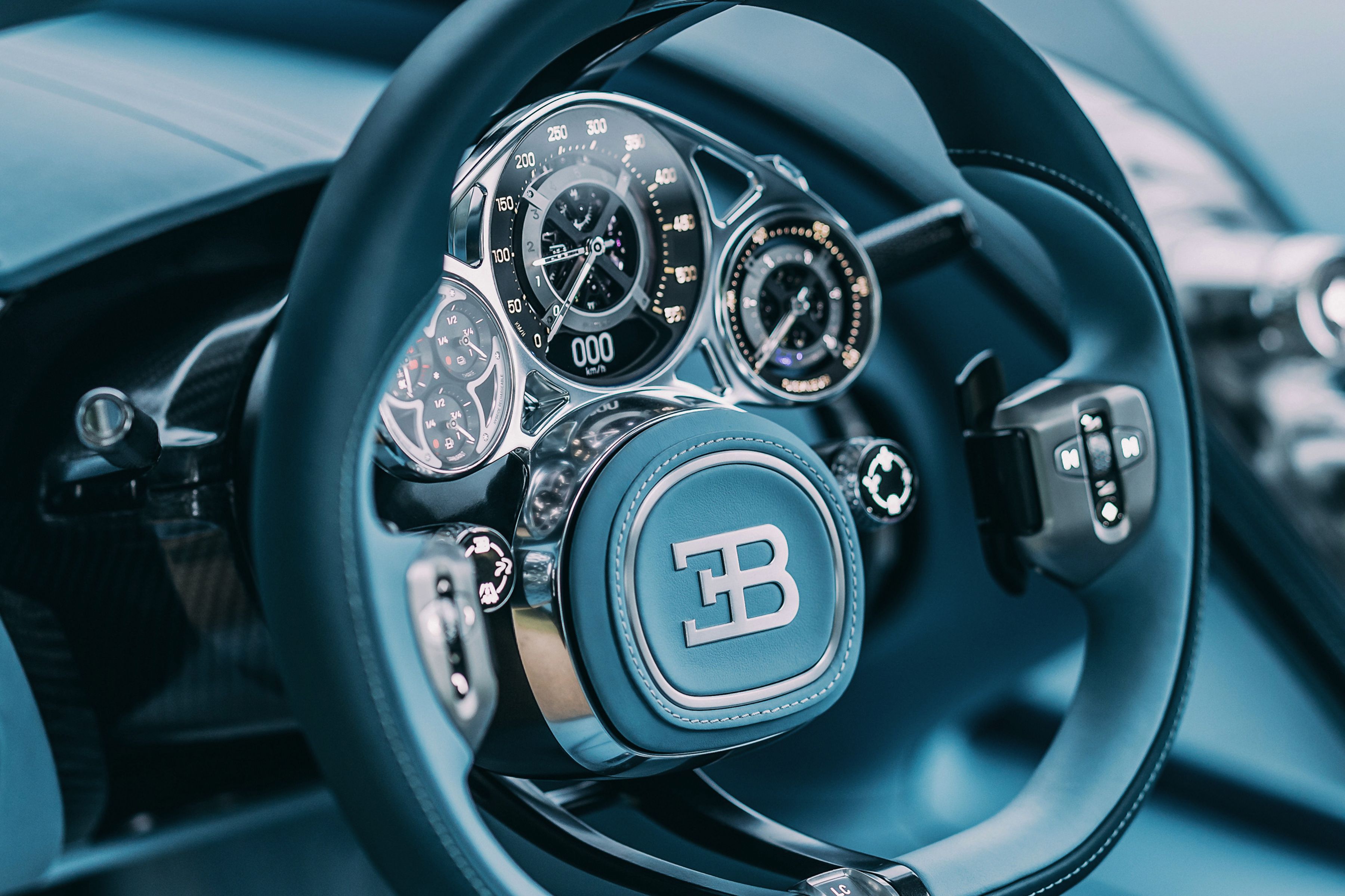 Bugatti Tourbillon - The dials highlight a fascination with the beauty of the mechanical; each gear and mechanism was developed together with master watchmakers in Switzerland.