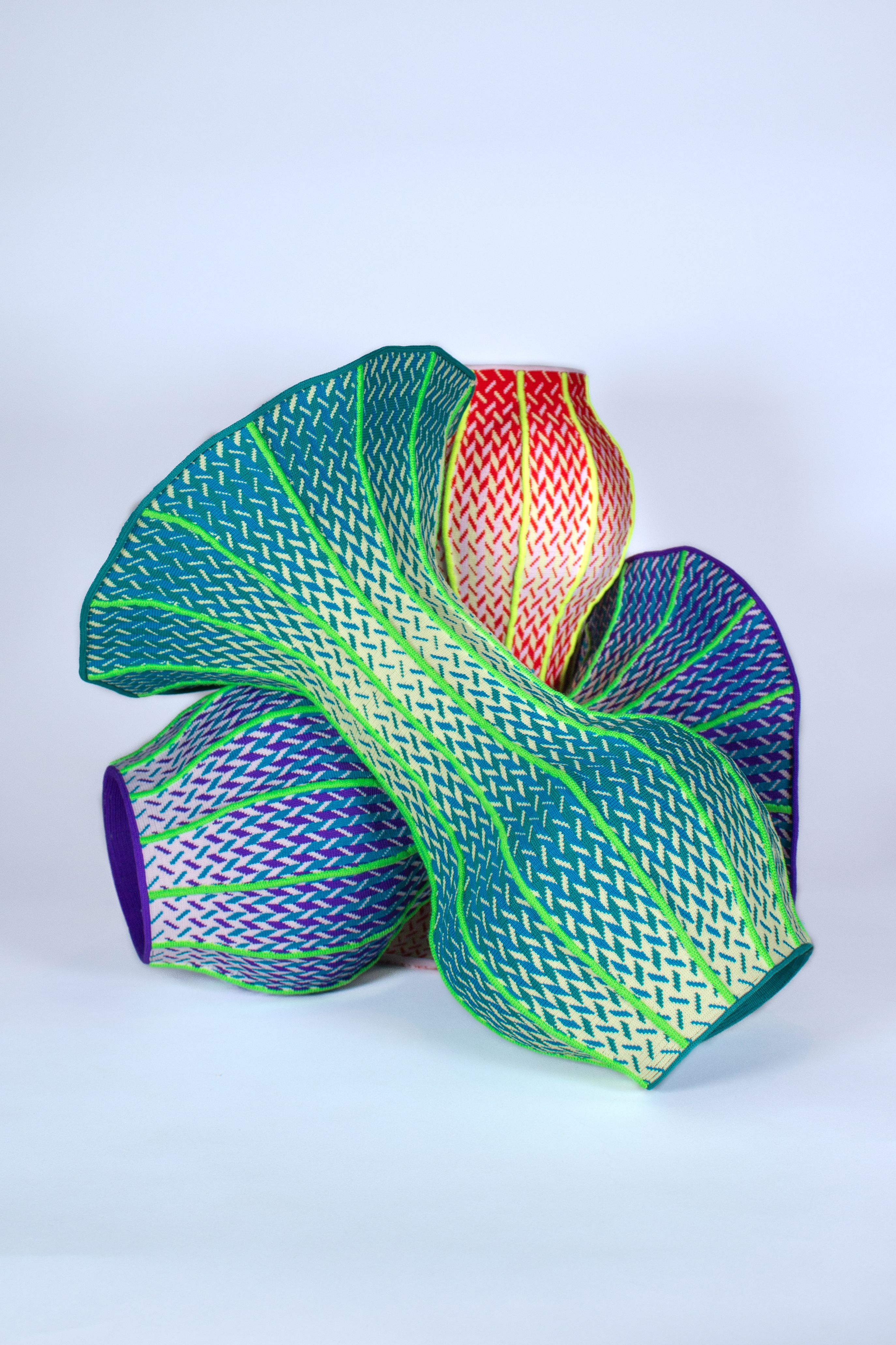 Gaspard Fleury-Dugy soft knitted objects in colorful textile forms.